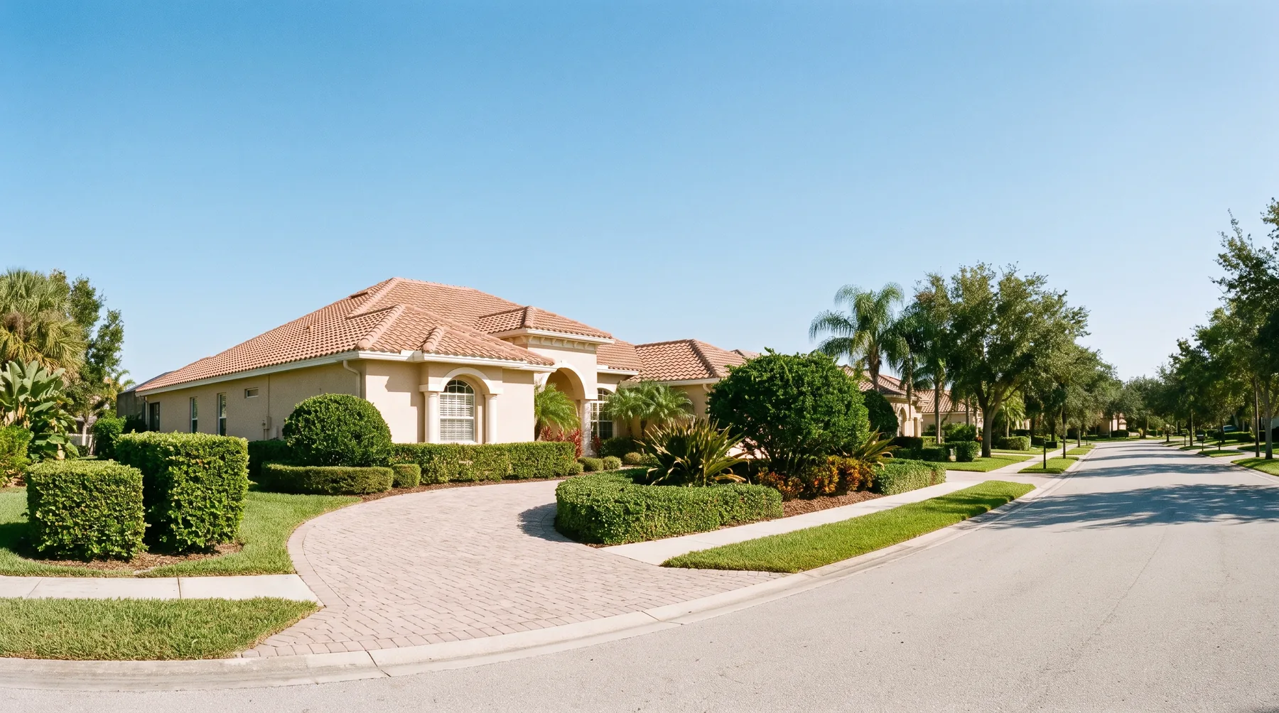 A single-storey Florida home with a paver driveway