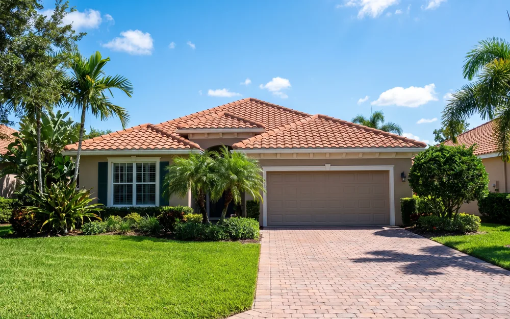 A single-storey Florida home with a paver driveway